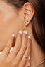 Topos Mia en oro 18K con piedra central en 4 uñas